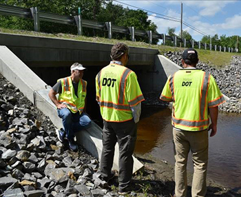 staff inspect a completed culvert replacement