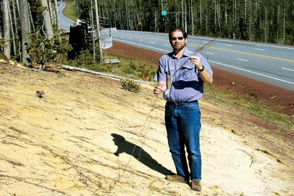 Photo of a person holding a whispy branch