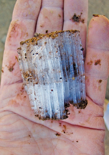 Photo of hand holding frozen ice