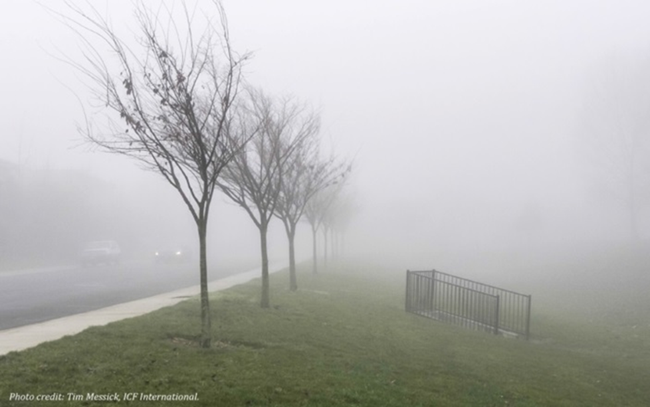 photograph of a road and the surrounding landscape during a fog event, which illustrates how atmospheric conditions can limit the size of a viewshed