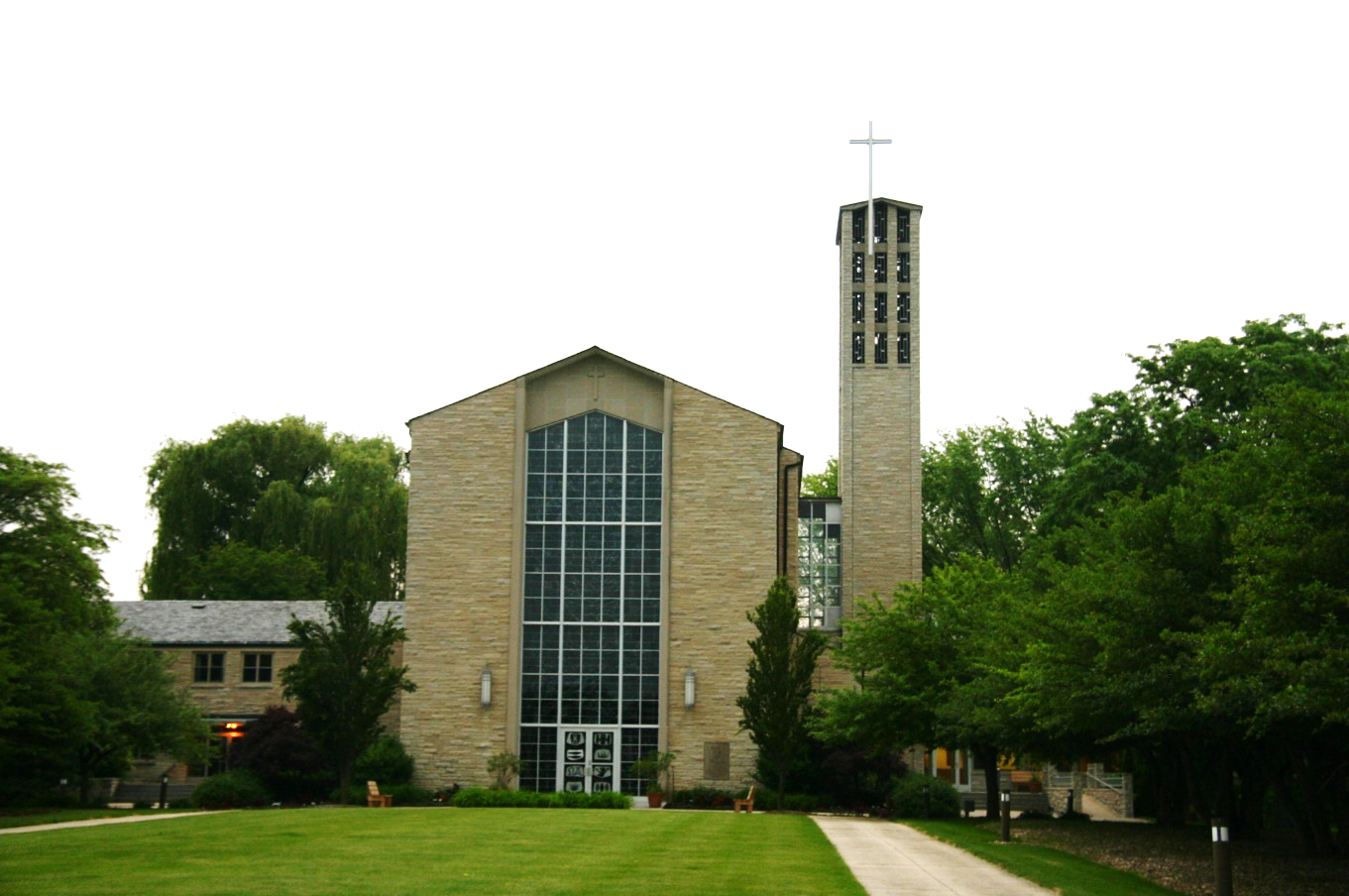 A photograph of a historic church and front lawn.