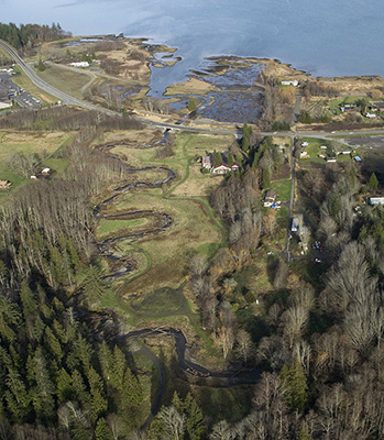 Aerial photograph of the restored Jimmycomelately Creek and estuary, looking towards Sequim Bay
