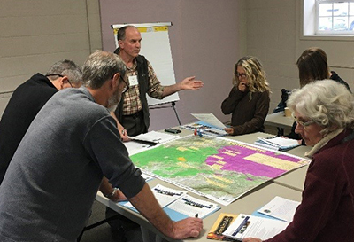 workshop attendees discussing in groups during the breakout session