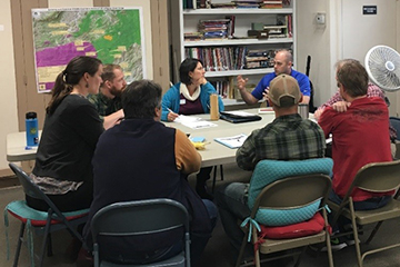 workshop attendees discussing in groups during the breakout session