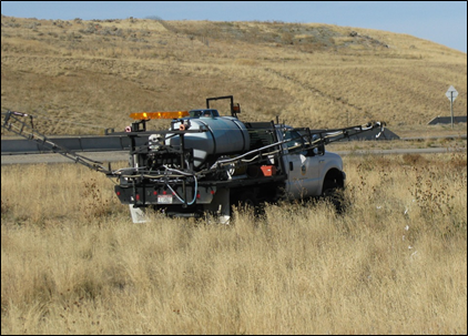 photo of a truck spraying herbicides