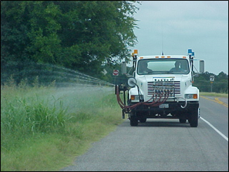 photo of a truck spraying herbicides
