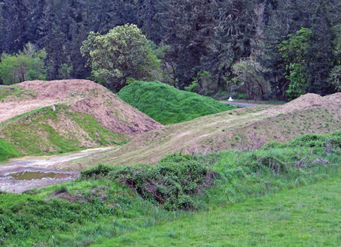 Photo two mounds of topsoil