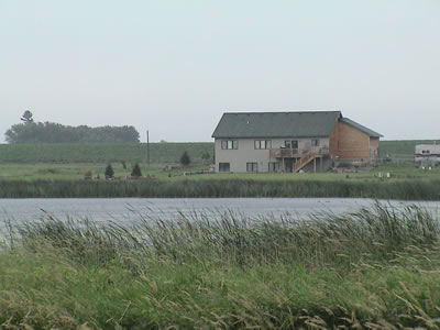 large house next to wetland