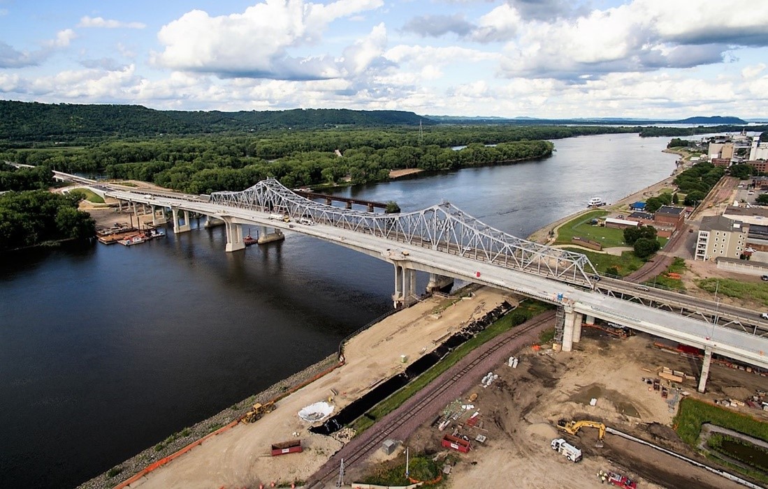 A bird's eye photograph of a large truss bridge spanning a waterway.