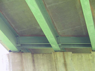 photo of staining on a pier on the underside of a bridge