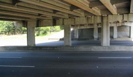 photo of the underside of a bridge showing stains on the sides of pier caps