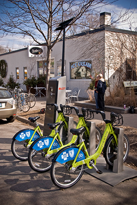 Photograph of a Nice Ride bike station with three bicycles