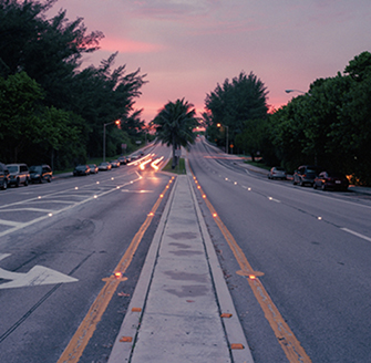 Photograph of State Road A1A at dusk showing the illuminated embedded lighting