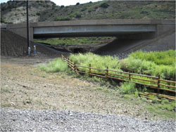 US 6, mile post 203: After road widening, box culvert replacement with a bridge